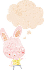 cartoon rabbit and thought bubble in retro textured style