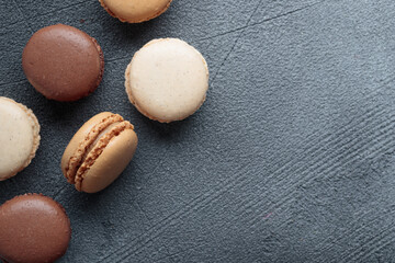 Colorful pastel eco handmade natural macaroons on dark background. Gift for 8 March, International Women's Day, Valentine Day, top view