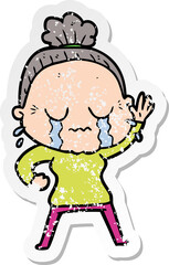 distressed sticker of a cartoon old woman crying and waving
