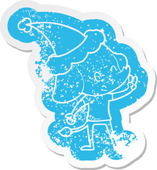 cute cartoon distressed sticker of a elephant wearing santa hat