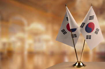 Small flags of the South Korean on an abstract blurry background
