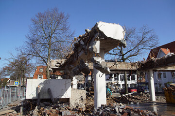 Demolition flat, apartments (Bakemaflat) in the Dutch village of Bergen. Construction site with concrete, rebar, pillars, rubble, fence, sky. March. Netherlands