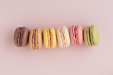 Macaroons on pink background, colorful french cookies pattern. Gift for 8 March, International...