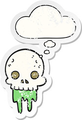 cartoon spooky halloween skull and thought bubble as a distressed worn sticker