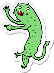 sticker of a cartoon gross little monster