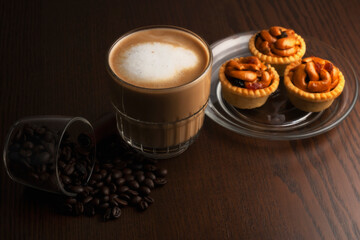 Hot coffee and coffee beans and grain tarts