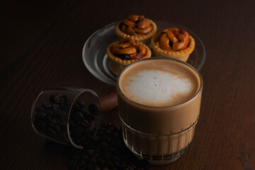 Hot coffee and coffee beans and grain tarts
