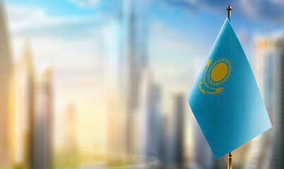 A small Kazakhstan flag on an abstract blurry background