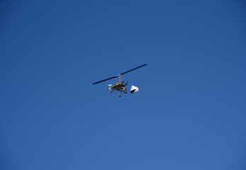 Ultralight autogyro in flight, Gran Canary, Spain