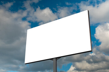 Blank white billboard or large display against blue sky with white clouds - mock up. Consumerism, advertising, white screen, template, copy space and mockup concept