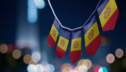 A garland of Andorra national flags on an abstract blurred background