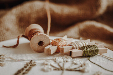 Threads, wooden, hoop on the background of old fabric burlap
