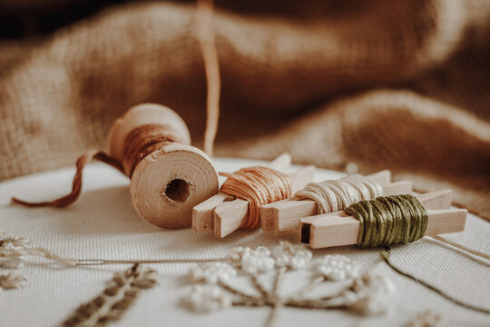 Threads, wooden, hoop on the background of old fabric burlap