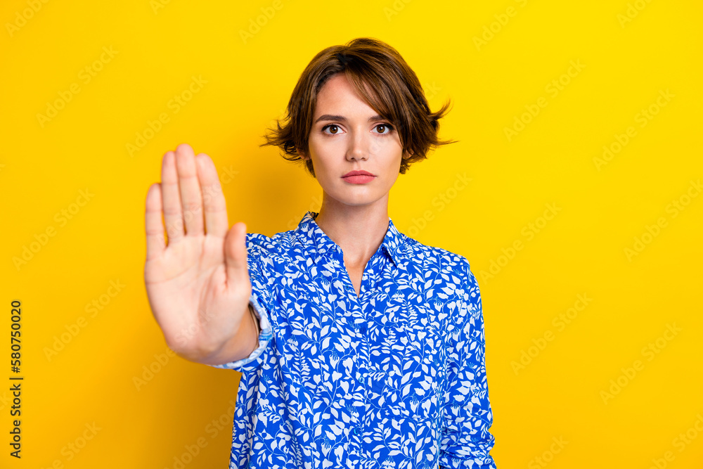 Poster Photo of serious confident lady wear print shirt rising arm asking stop isolated yellow color background