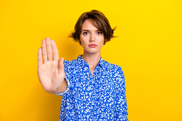 Photo of serious confident lady wear print shirt rising arm asking stop isolated yellow color background