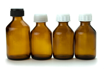 Medical medicine bottle with white and black cap isolated on white background.