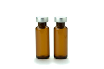 Medical bottle of brown color, for medicine and injection, with a lid, isolated on a white background.