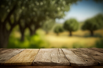 wooden table for product display with bokeh background of a natural olive field