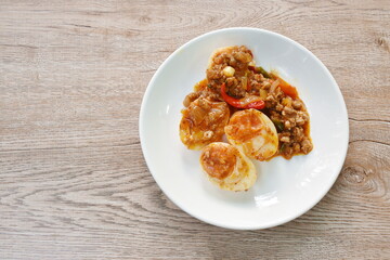 slice boiled egg dressing spicy fried chop pork and curry on plate