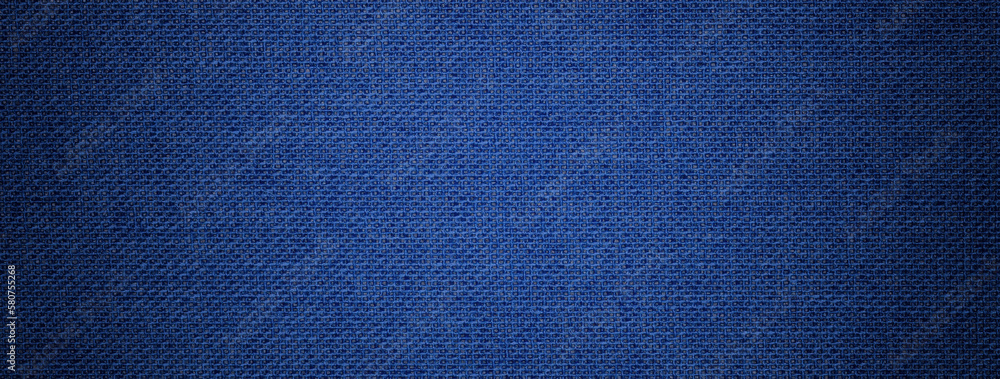 Wall mural navy blue background from textile material with wicker pattern, and vignette. structure of denim fab