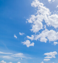 Naklejka na ściany i meble Panoramic view of clear blue sky and clouds, Blue sky background with tiny clouds. White fluffy clouds in the blue sky.