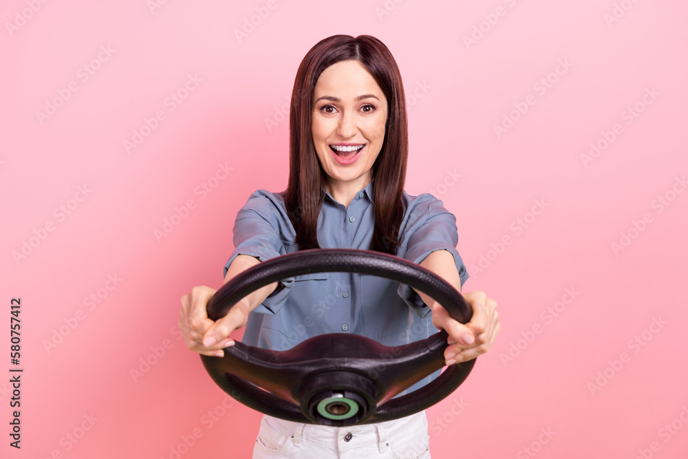 Sticker Photo of cheerful positive lady manager agent wear trendy blue clothes driving news own car rejoice trip isolated on pink color background