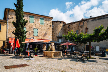 Terrace of a restaurant in summer on the main square of Boulieu Les Annonay in the south of France...