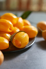 Fresh sweet marian plum on background