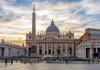 Fototapeta na wymiar St. Peter's basilica on St. Peter's square in Vatican at sunset, center of Rome, Italy