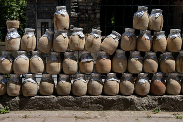 Closeup pattern view of clay pots in Istanbul, Turkey. The jugs using for preparing the Testi Kebab (Pottery Kebab).