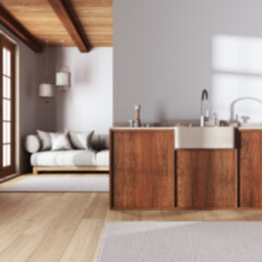 Naklejka na ściany i meble Blurred background, japandi trendy kitchen and living room. Wooden cabinets, contemporary fabric sofa. Minimalist interior design