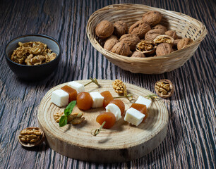 Typical Spanish dessert. Fresh goat cheese and quince jelly, accompanied by walnuts. Mediterranean cuisine.