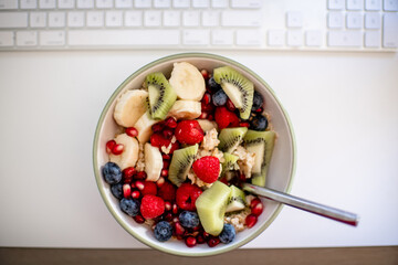 Fruit and oatmeal at work desk