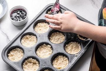 Kid chef cook at kitchen. Child prepares food . Kids cooking.