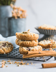 round festive pastry buiscuits cookies  with a raspberry jam on a light grey background.