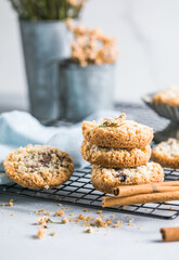 round festive pastry buiscuits cookies  with a raspberry jam on a light grey background.