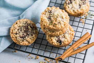 round festive pastry buiscuits cookies  with a raspberry jam on a light grey background.