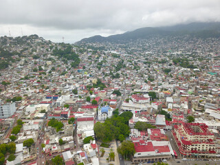 Aerial View of Acapulco's City Center Amidst Clouds and Historic Landmarks