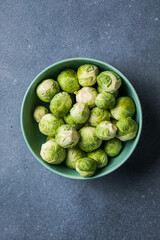 Raw Organic Brussel Sprouts in a Bowl, top view. Flat lay, overhead, from above. Copy space.