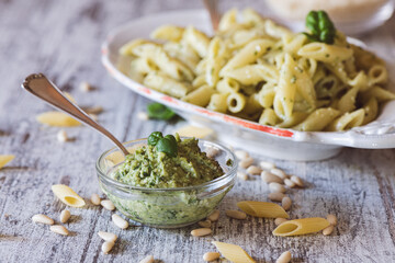 Fresh home made Pesto sauce and pasta on a kitchen table