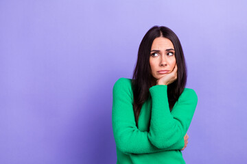Photo of upset bored woman wear green pullover arm chin looking emtpy space isolated purple color background - obrazy, fototapety, plakaty