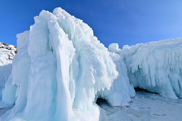 Rock Cliff Covered with Ice Splashes and Snow During Winter at Lake Baikal