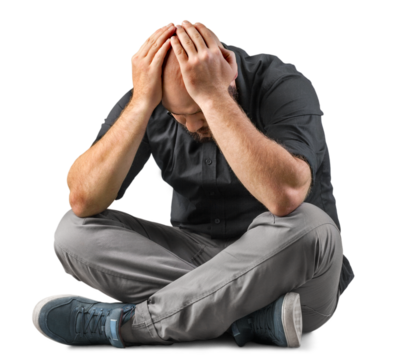 Sad handsome young man sitting holding your hand over on the head - Powered by Adobe