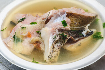 Hot fish soup with various vegetables in Kaziuko Muge or Saint Casimir's Fair, a spring annual folk arts and crafts fair in Vilnius, Lithuania, Europe, close up