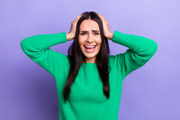 Photo of impressed depressed lady dressed green sweater arms head having headache isolated violet color background - obrazy, fototapety, plakaty