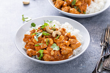 Traditional thai chicken curry with cashews and herbs