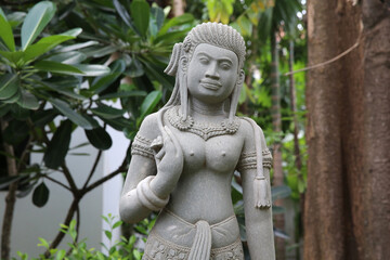 Apsara statue in a Khmer garden. Cambodia.