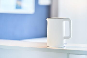 White electric kettle on the table