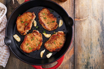 Pork chops cooked in a cast iron pan
