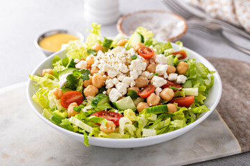 Fresh vegetable salad with chickpeas and feta